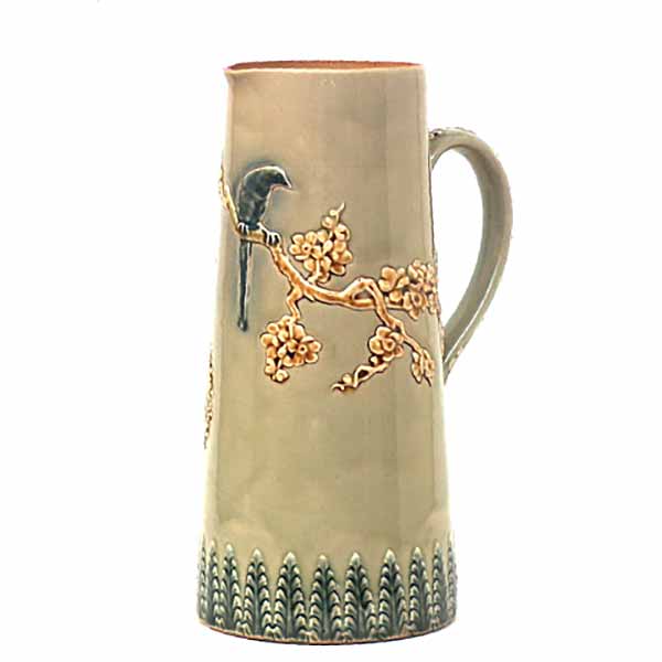 A Doulton Lambeth 9" jug with bird and branch decoration by Emily Welch