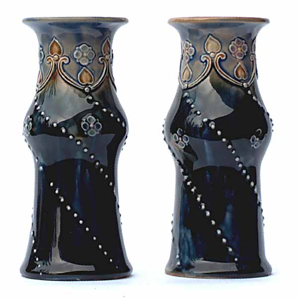 A pair of Royal Doulton vases, one by Lily Partington