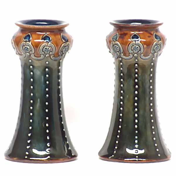 A mint pair of Royal Doulton 5.5in vases, one by Marion Holbrook