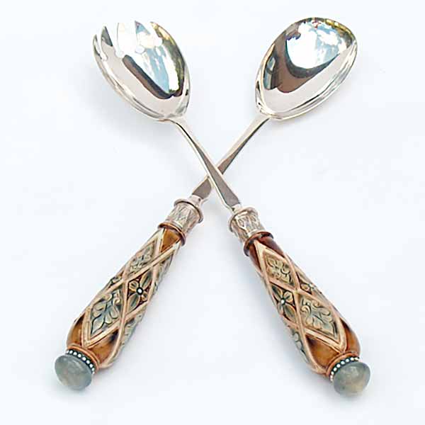 A pair of silver plated salad servers with Doulton Lambeth stoneware handles.