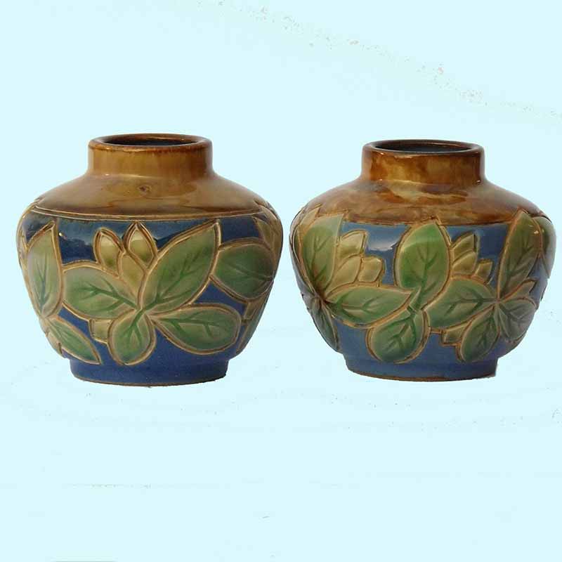 Vera Huggins - a pair of 4in (10cm) Royal Doulton vases