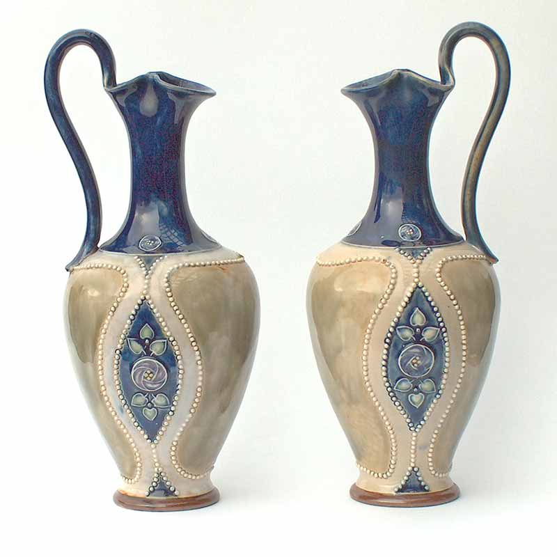 Pair of Royal Doulton Art Nouveau stoneware ewers